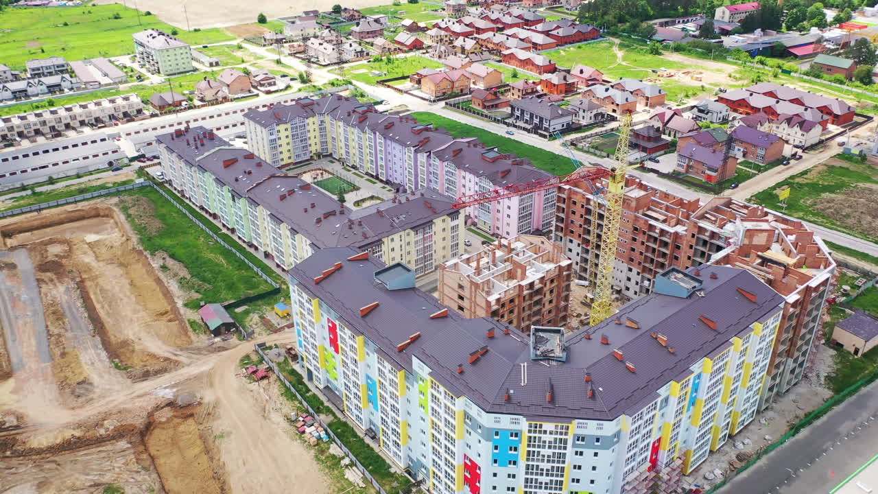 Flying over the construction site. Aerial view of construction of the plant in the city