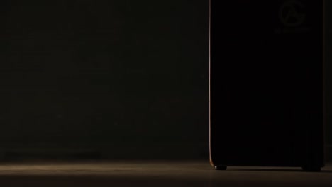 low pov of flamenco dancer sitting on cajon and tapping her hand on it. static