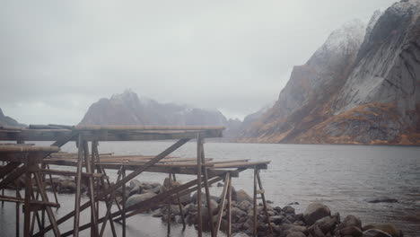 empty racks to dry cod fish at reine village, lofoten, norway on cloudy day