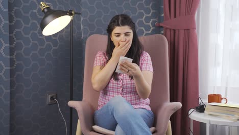 Woman-looking-at-high-electricity-bill-turns-off-the-lights.