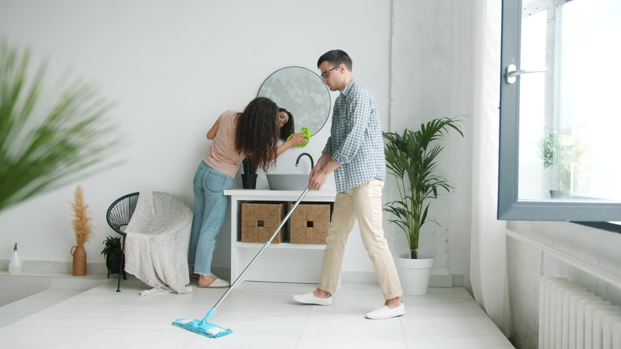 Couple Cleaning a Room