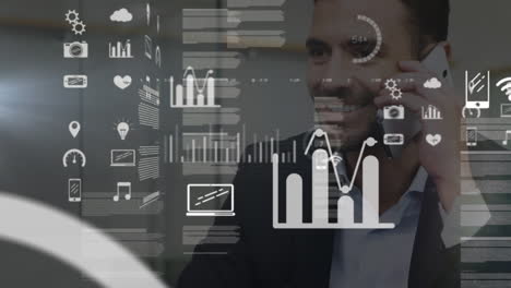 animation of data processing over happy caucasian businessman talking on smartphone at office