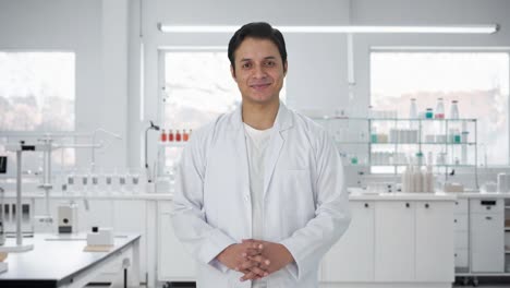 happy indian scientist smiling to the camera