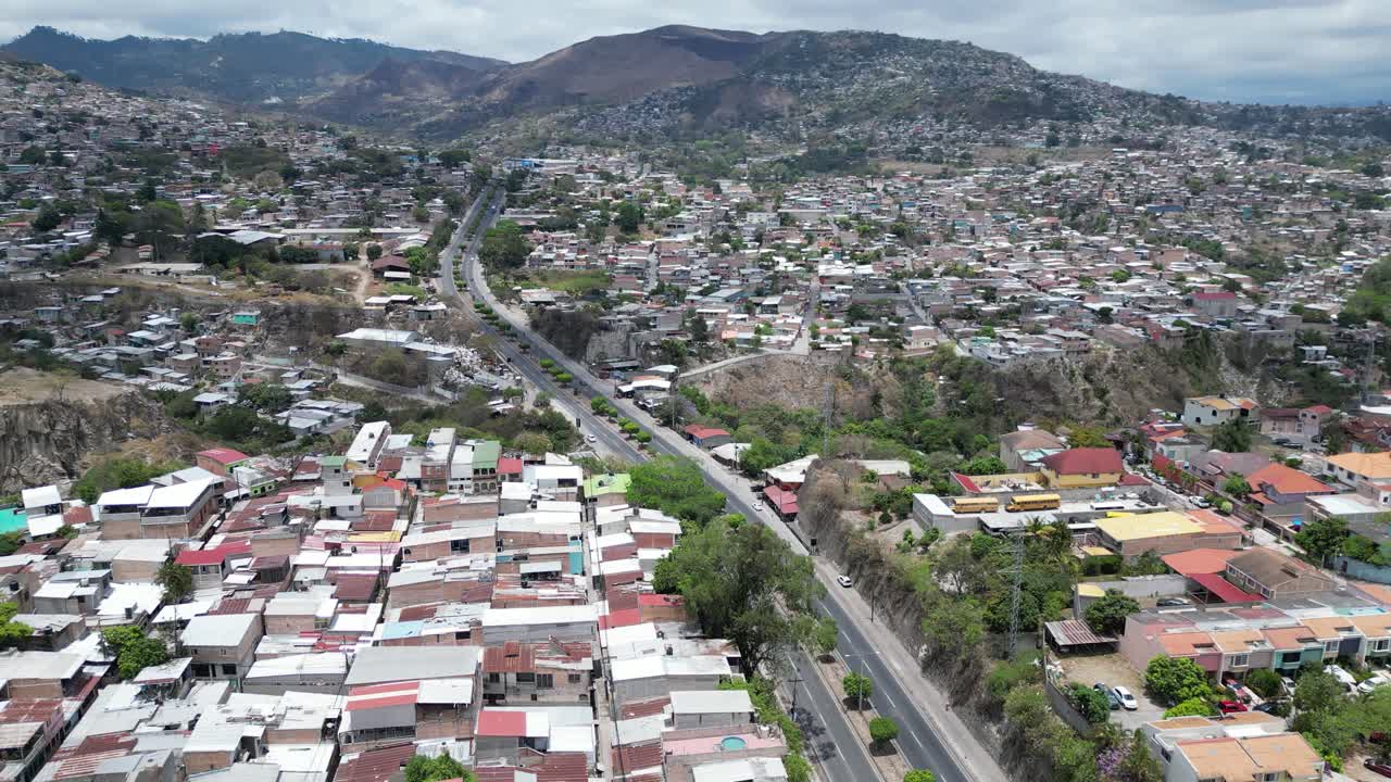 Aerial view of residential zones in Tegucigalpa, Honduras, divided by central highway