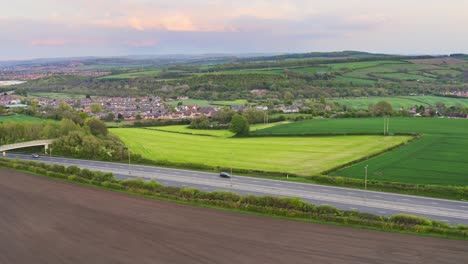 Aerial-shot-of-fields-and-woods-and-hills-in-Yorkshire,-North-England