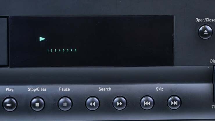 tape recorder close-up, woman presses the stop button and opens the CD