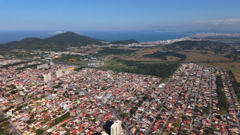 aerial view of sprawling residential areas of penha, gravatá, navegantes in one shot, santa catarina, brazil