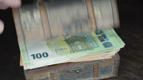 bitcoin, euro banknotes and golden btc coins on the treasure trove
