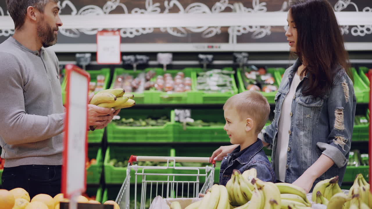Family Shopping for Bananas at the Grocery Store
