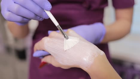 applying hand cream or mask