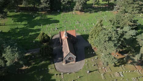 Overhead-View-Of-A-Small-Chapel-Amidst-The-Graveyard-Of-Wymondham-Cemetery-In-Wymondham,-England