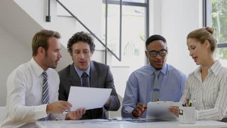 Businesspeople-working-together-around-a-table