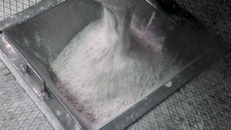 casting a mass of ceramic tiles into a gutter