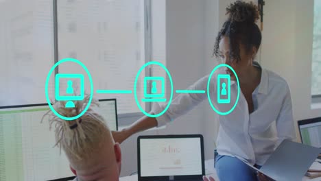 animation of icons and data processing over diverse business people in office