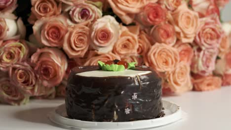 dolly: extra large bouquet of pink roses and chocolate birthday cake