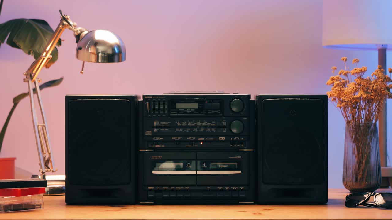 Retro radio tape recorder, audio cassette close-up. Listening to music, old radio boom box player, macro of vintage music listening. . High quality 4k footage