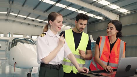 aircraft maintenance team discussing repairs
