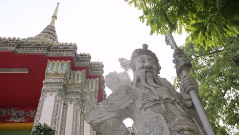 thai temple gateway and statue with sun back light