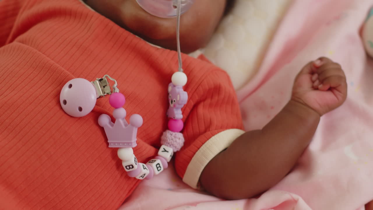 Adorable Infant with Pacifier Taking Nap