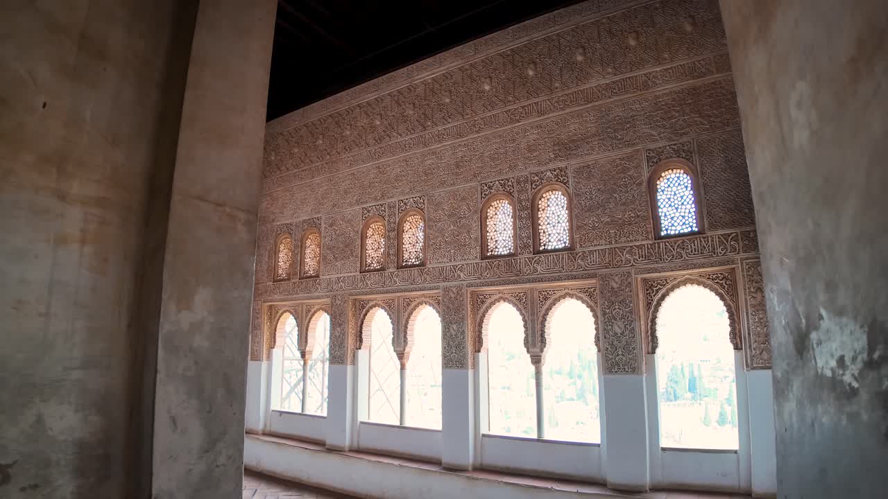 First-person shot of interior details inside a viewpoint, showcasing arabesque motifs, in the Alhambra in Granada, Spain