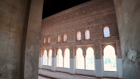 first-person shot of interior details inside a viewpoint, showcasing arabesque motifs, in the alhambra in granada, spain