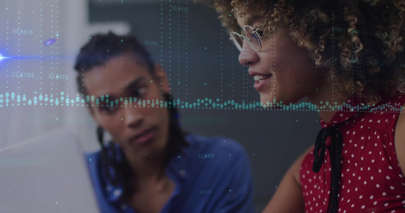 Animation of lights and graphs over hands of diverse businesspeople working on laptops