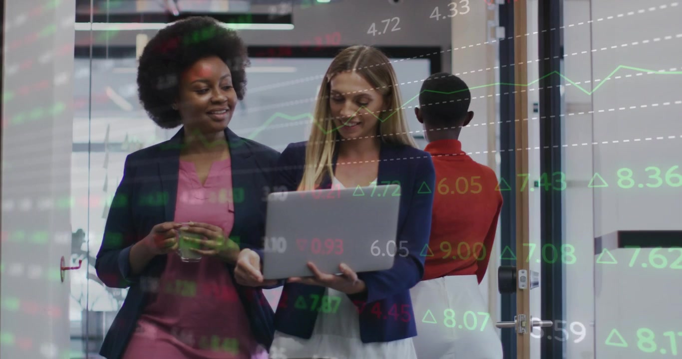 Two women walking, woman opening laptop and holding forward, finance overlay guiding data review