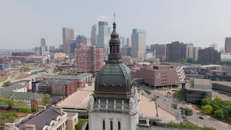 the basilica of saint mary with minneapolis skyline in the background, aerial