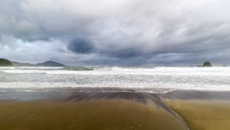 wide angle shot of a remote beach overlooking the sea of japan on a cloudy day with stormy seas