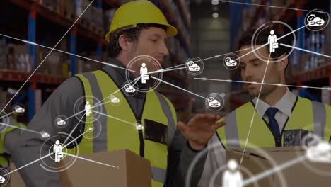 Animation-of-network-of-connections-with-icons-over-men-working-in-warehouse