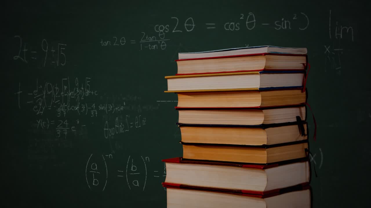 Tumpukan buku dan persamaan matematika serta grafik