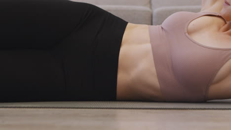 woman doing core exercises at home