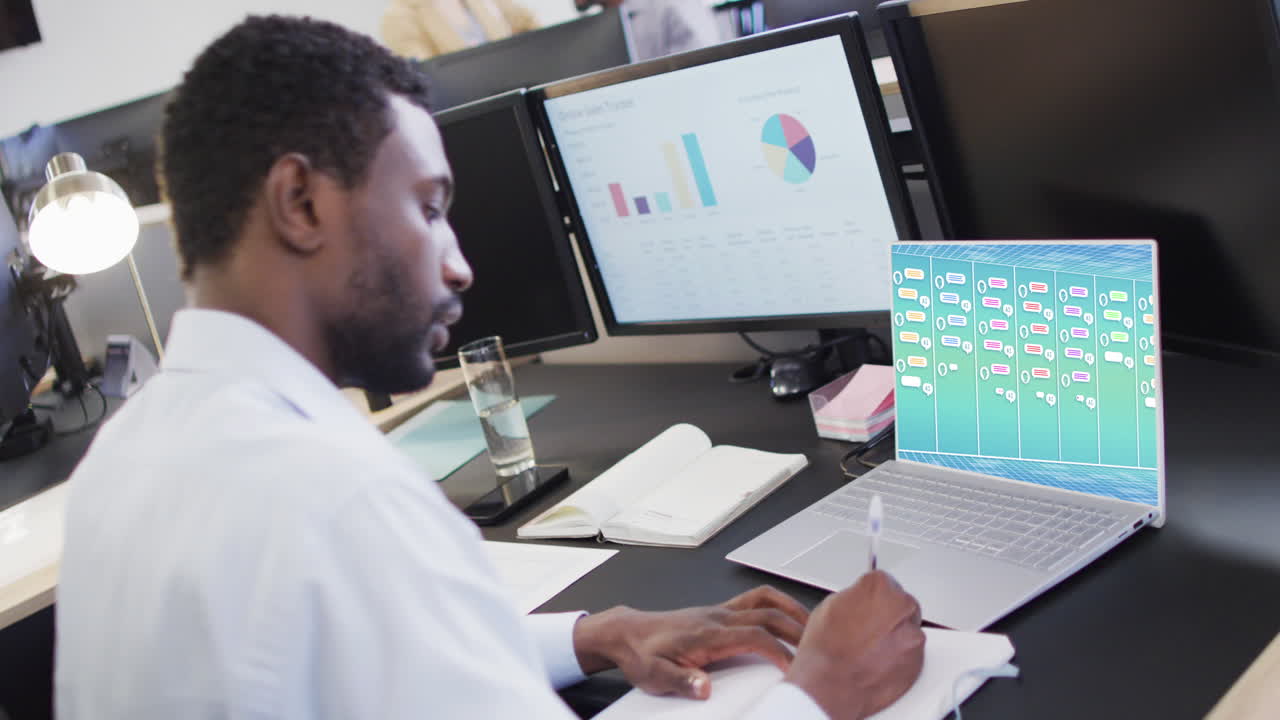 Composition of african american businessman using laptop with ai chat on screen