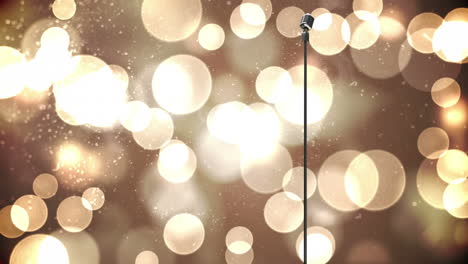 animación del micrófono rerto sobre el bokeh brillante