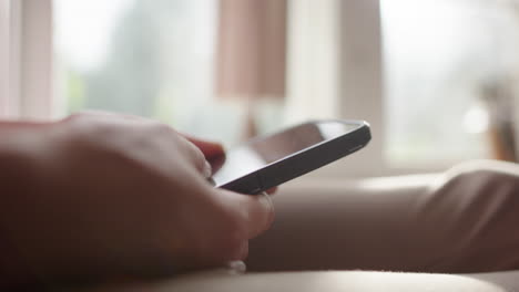 mindless scrolling on smartphone, lots of screen time in tech age. hand closeup