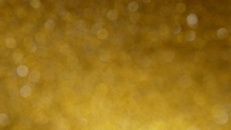 abstract gold glitter background with bokeh effect