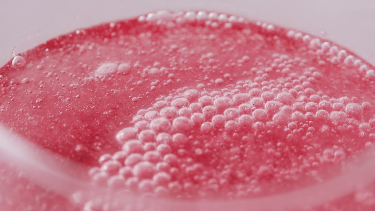 Close-up of Fizzy Pink Drink with Bubbles