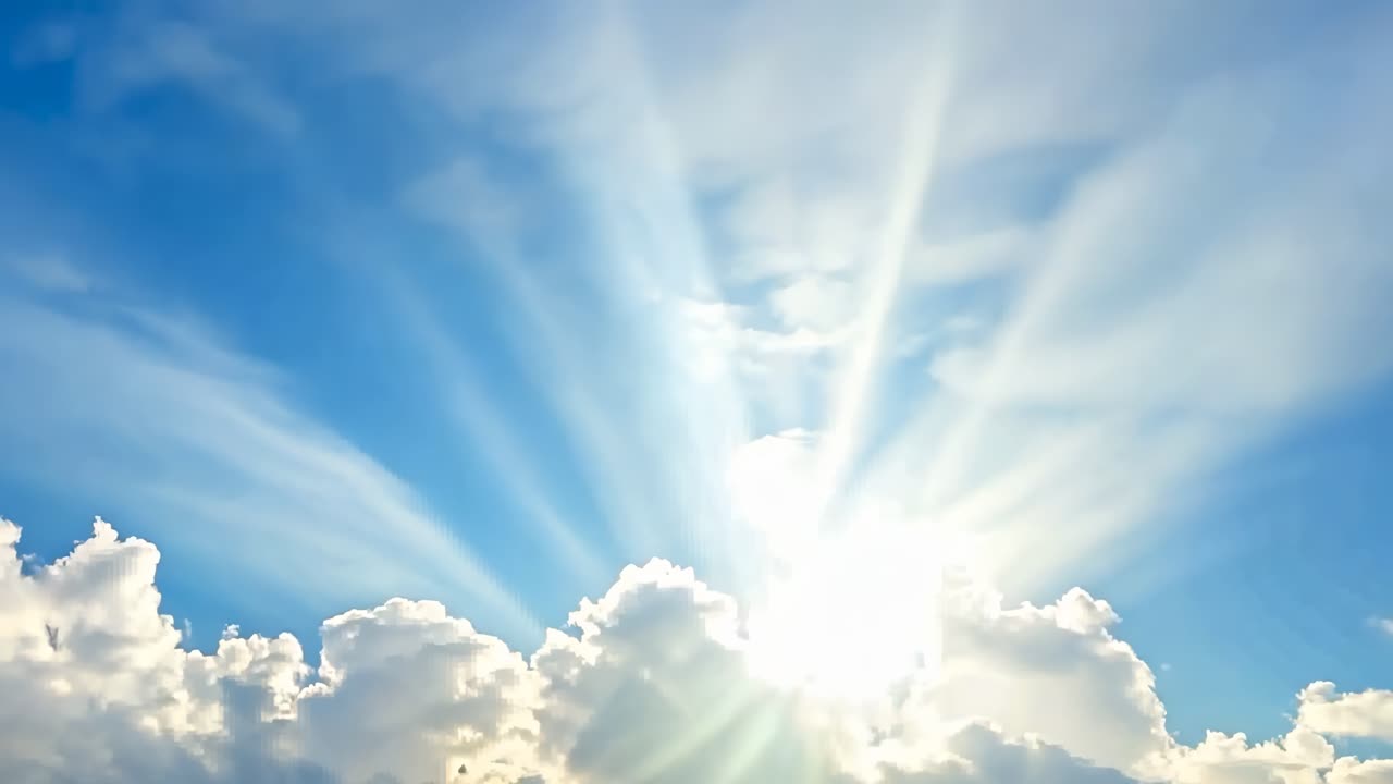 A serene video scene of sun rays streaming through fluffy clouds, captured from a low angle