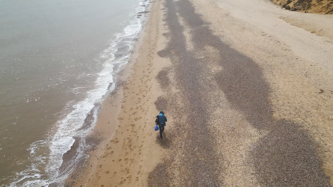 Person walking alone on a beautiful beach