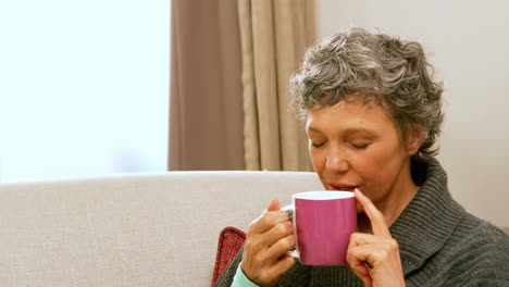 Woman-drinking-hot-beverage