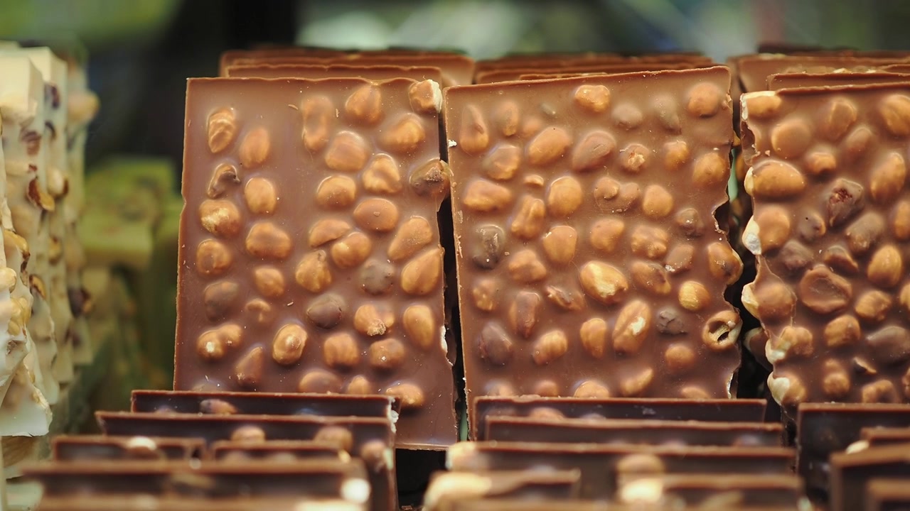 Rows of Milk Chocolate Bars with Whole Hazelnuts