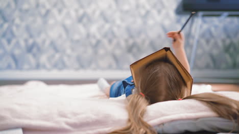 little girl with blonde hair in pigtails