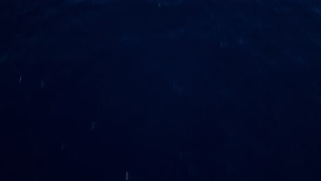 aerial view of calm ocean, a tranquil and serene scene with vast blue water, perfect for backgrounds