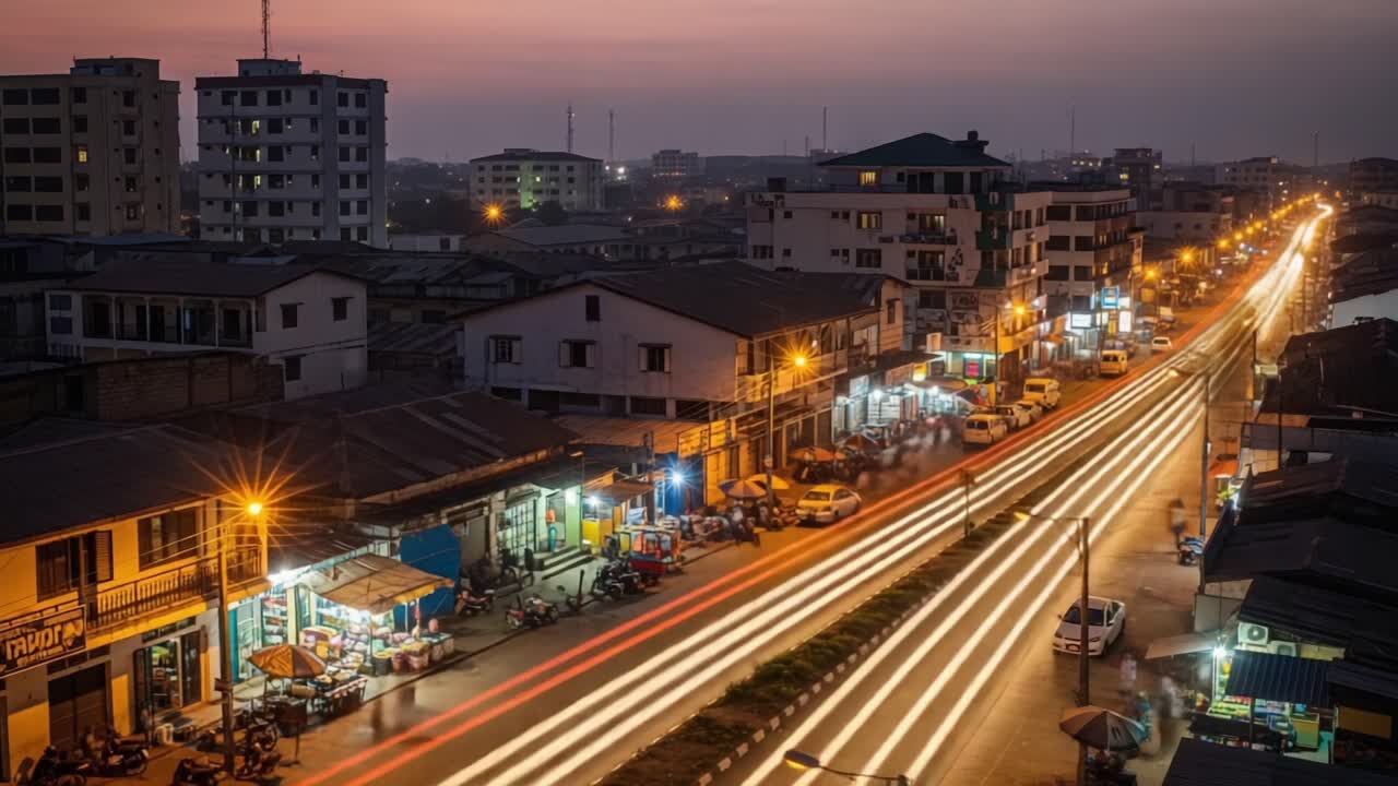 A Breathtaking Evening Cityscape Transition: Capturing the Vibrant Glow and Lively Energy of Urban Life as Day Turns to Night with Bustling Streets and Bright Lights