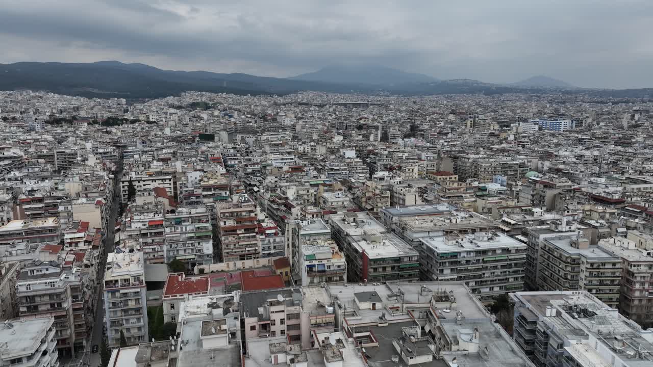Vertical traveling shot of the big city Thessaloniki on a cloudy day, Greece.