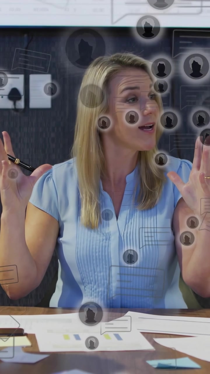Vertical video: Woman raising hands, leading business meeting while AR icons drifting across face