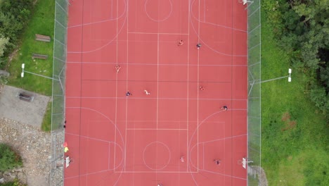 overhead shot of outdoor football on clay: drone slow zoom