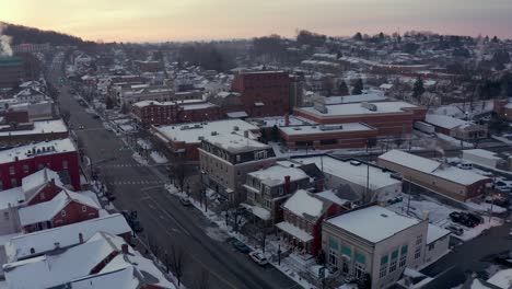 aerial establishing shot of storefronts and business in small town