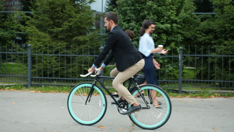 businessman on a bicycle in an urban setting