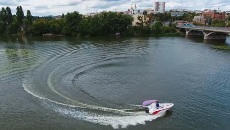 Boat sailing on river. Aerial view of ship floating the river